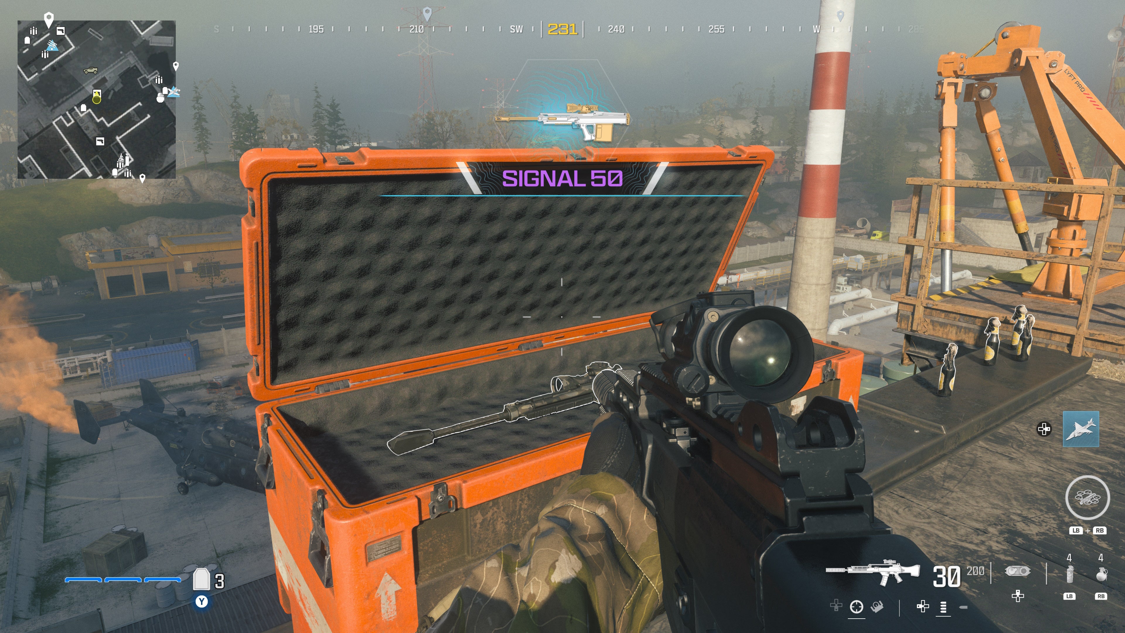 looking at an item in an open orange supply box on the reactor level