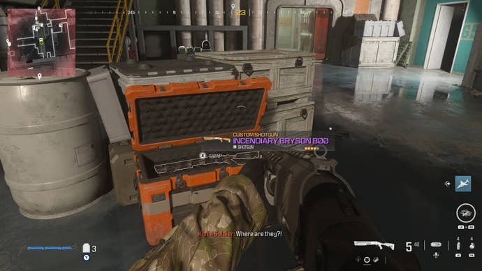 looking at an item in an open orange supply box on the reactor level