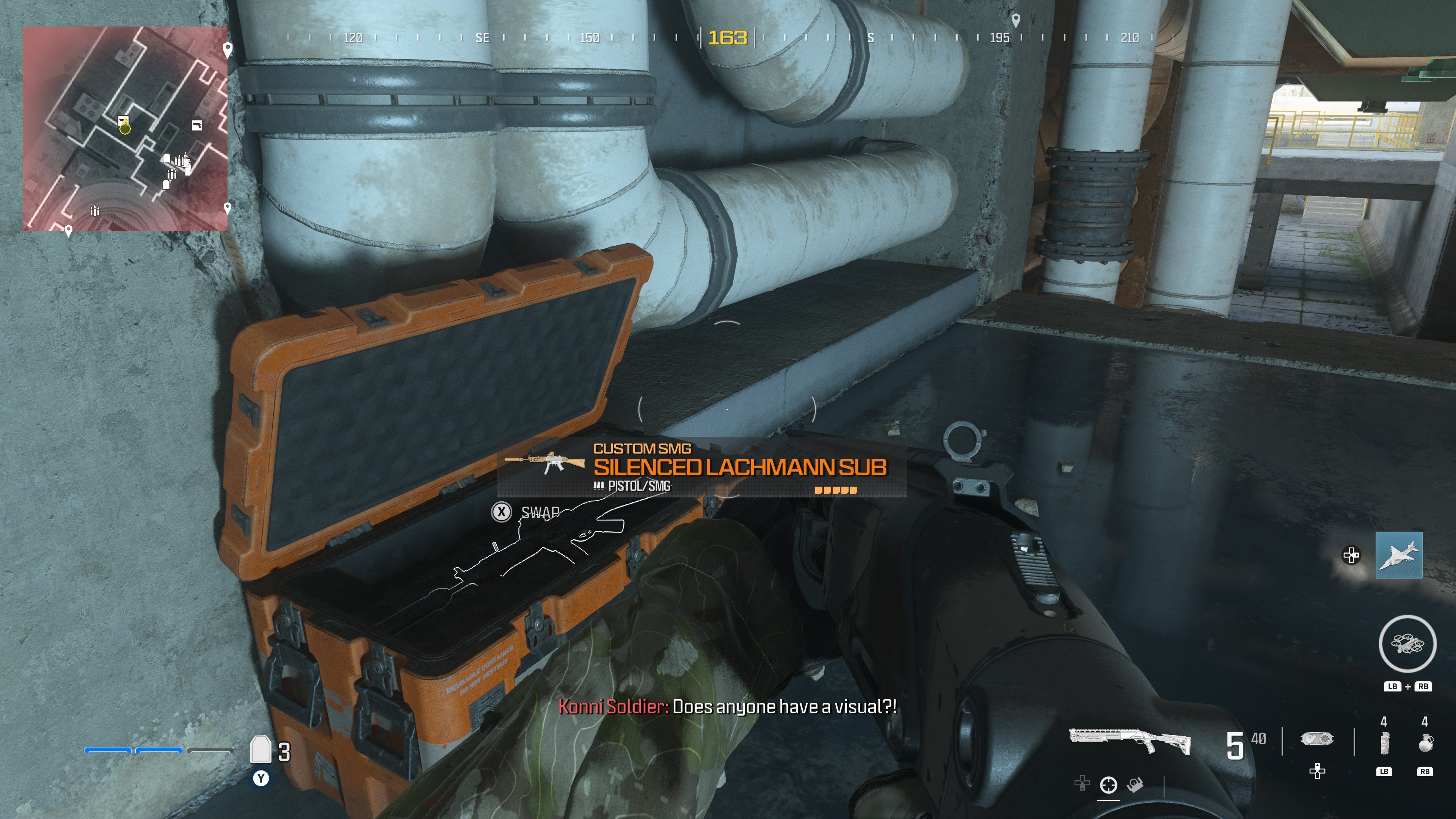 looking at an item in an open orange supply box on the reactor level