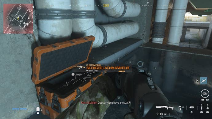 looking at an item in an open orange supply box on the reactor level