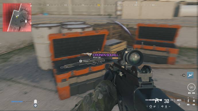 looking at an item in an open orange supply box on the reactor level