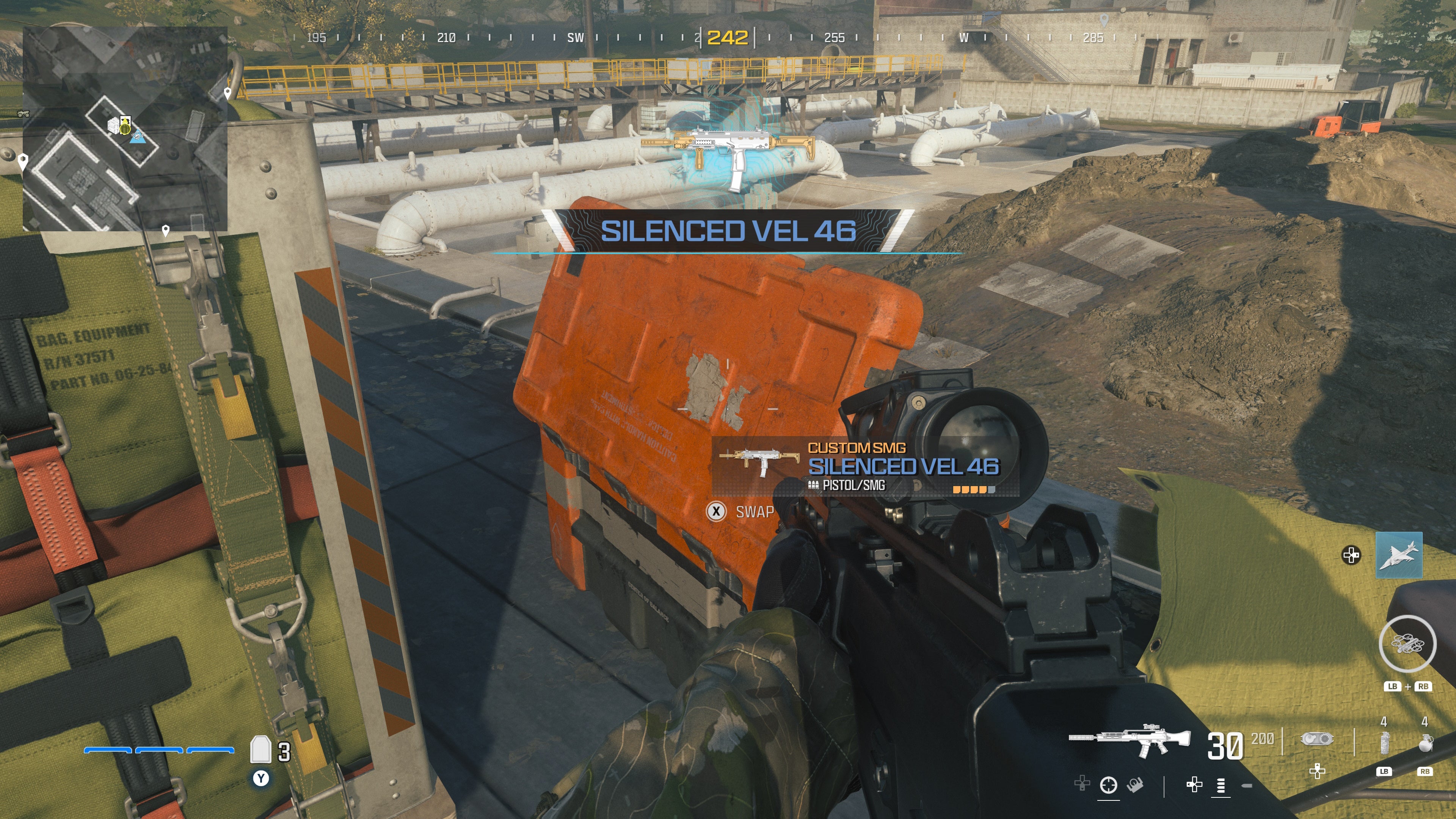 looking at an item in an open orange supply box on the reactor level