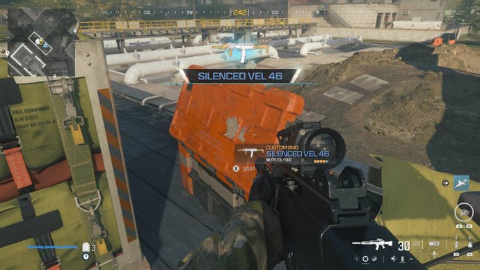 looking at an item in an open orange supply box on the reactor level