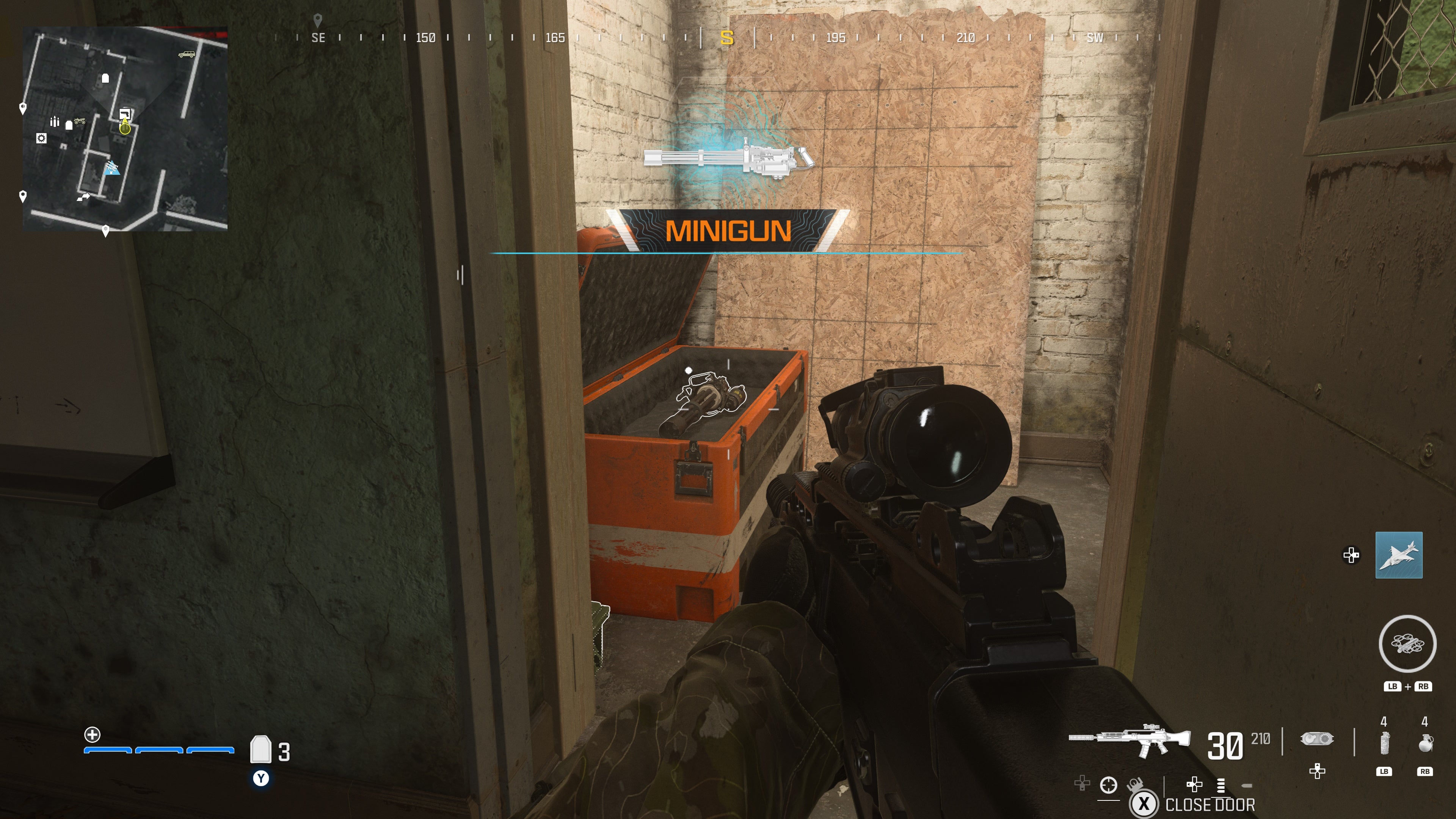 looking at an item in an open orange supply box on the reactor level