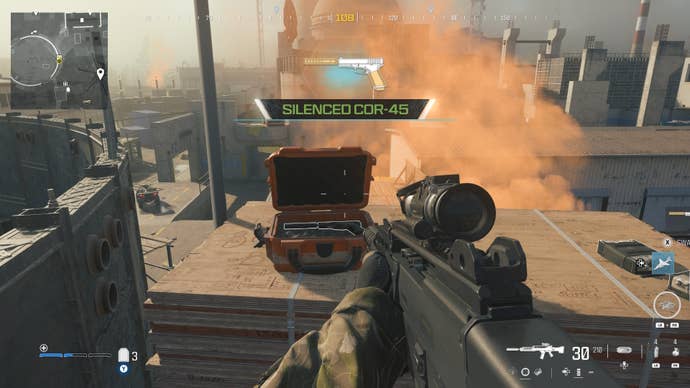 looking at an item in an open orange supply box on the reactor level