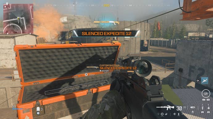 looking at an item in an open orange supply box on the reactor level