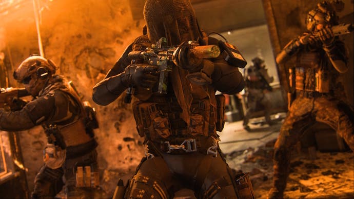 three soldiers holding their assault rifles up while storming a room covered in an orange tint