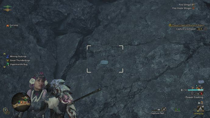 The player aims their Capture Net at a Gillopod on a wall in Wyveria in Monster Hunter Wilds