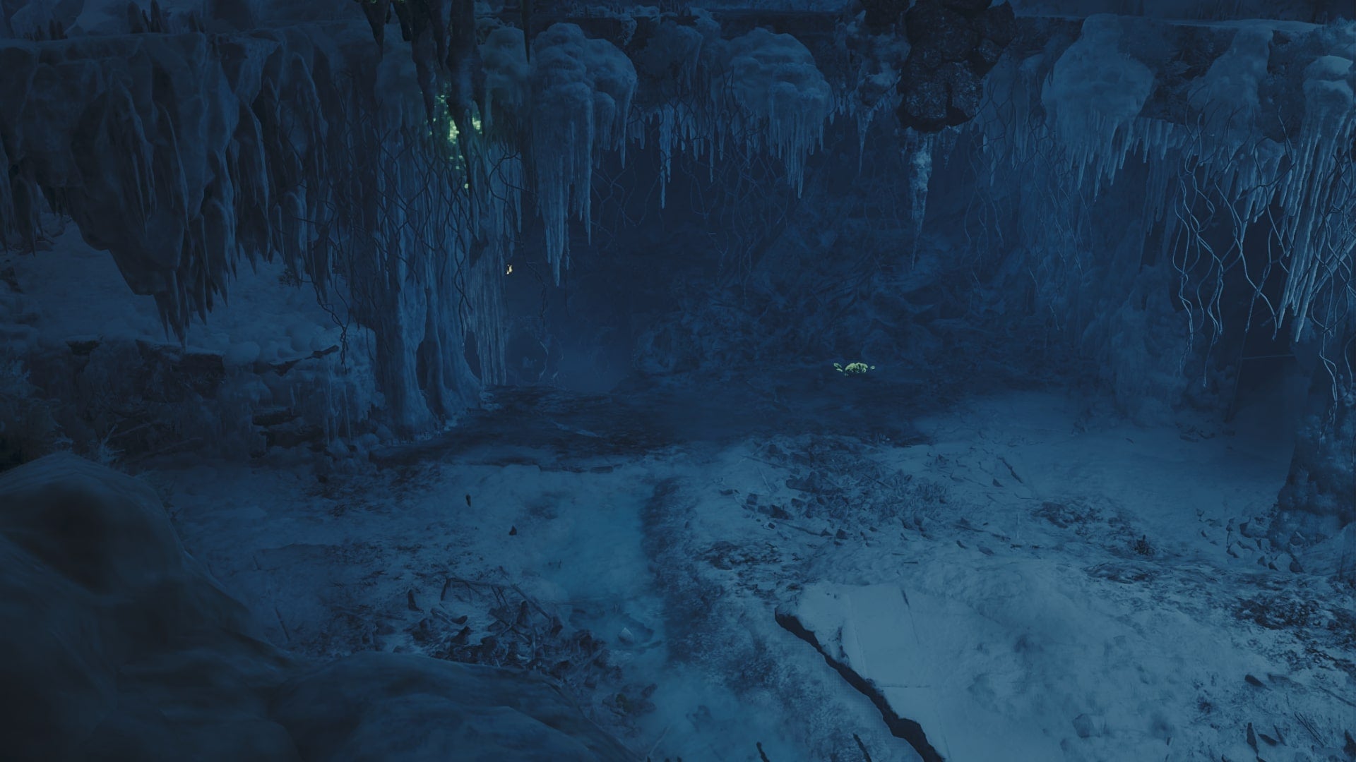 A cavern in Iceshard Cliffs, near the entrance to the biome's Base Camp, is shown in Monster Hunter Wilds