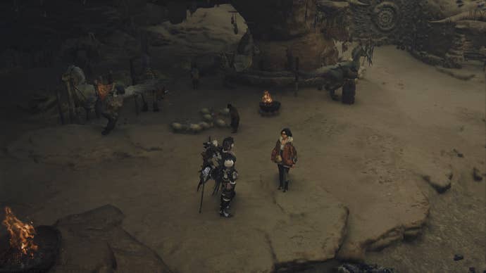 The player character can be seen - from overhead - speaking to Alma in the Oilwell Basin biome in Monster Hunter Wilds