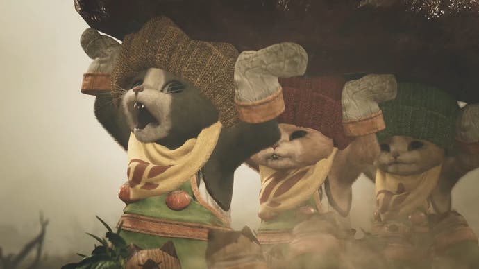 Monster Hunter Wilds trailer screenshot showing three cats carrying a heavy load