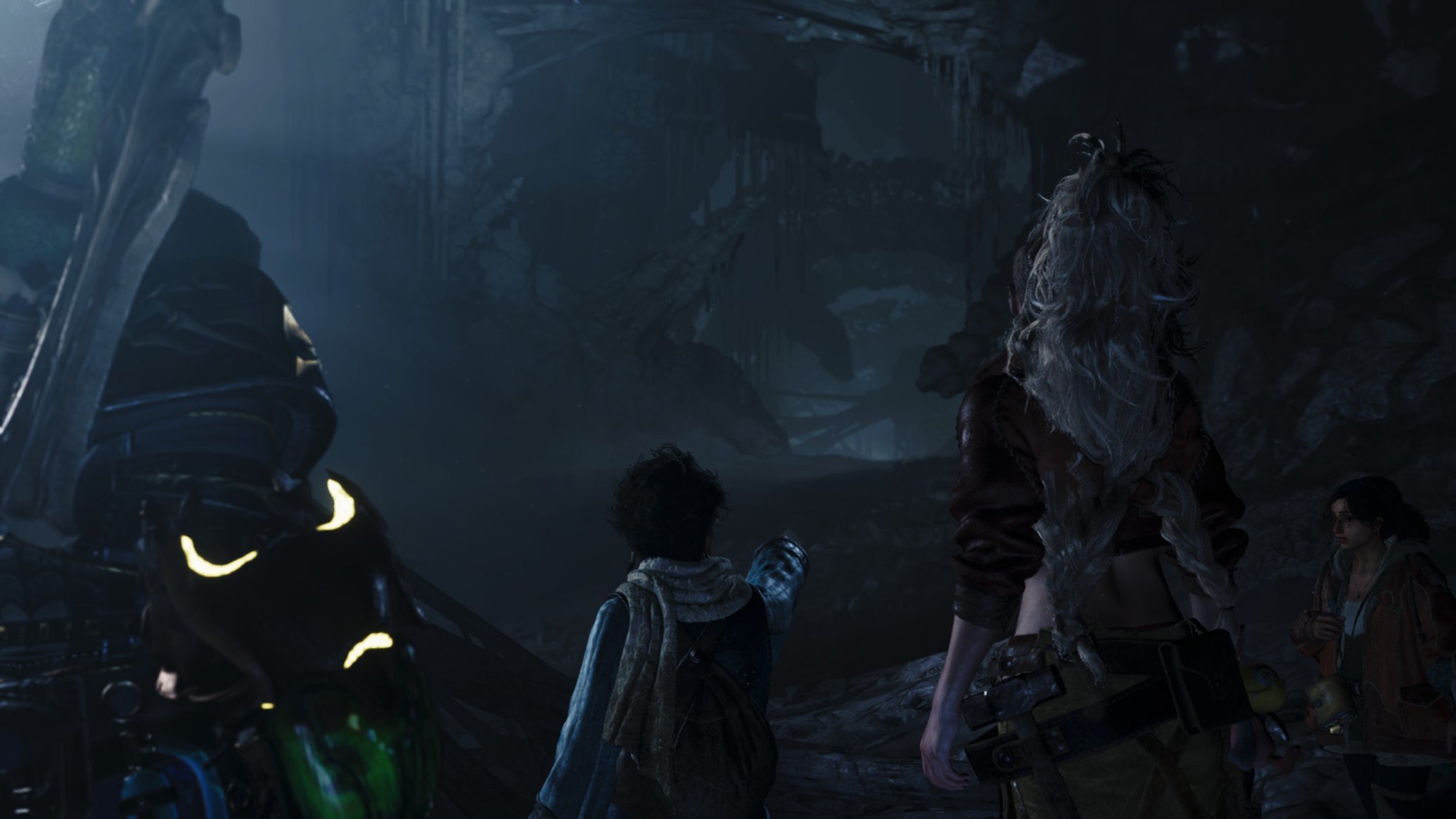 A Monster Hunter Wilds screenshot showing the hunter and three others looking at an icy tunnel in the distance. - 1