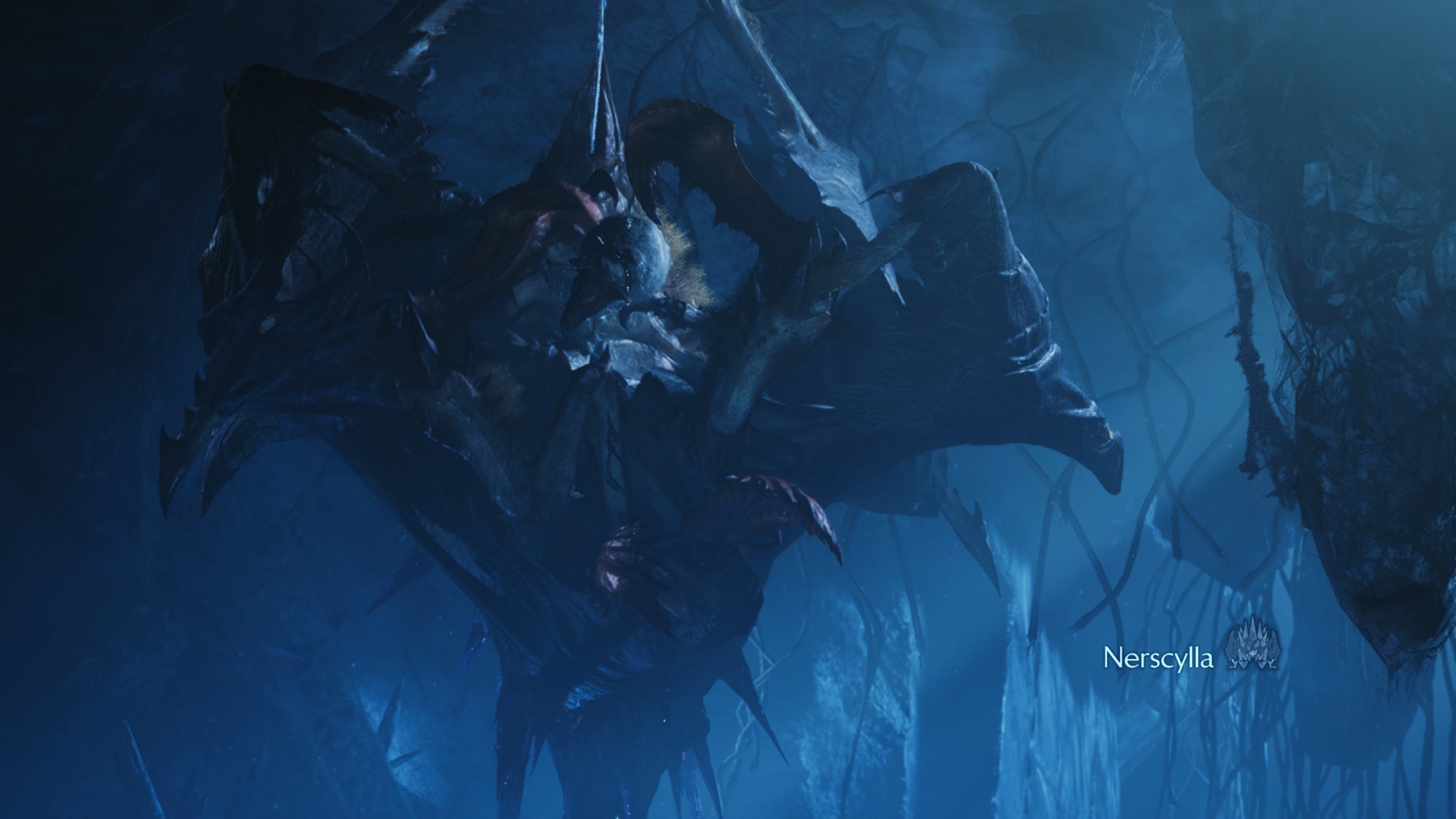 A Monster Hunter Wilds screenshot showing the Nerscylla spider monster upside-down hanging from the ceiling while spinning a Lynian creature into a ball. - 4