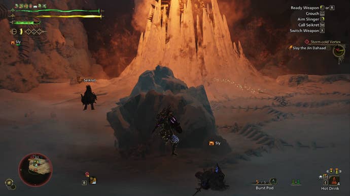 A Monster Hunter Wilds screenshot shows the hunter hiding behind an ice chunk while Jin Dahaad is covered in large ice walls further away.