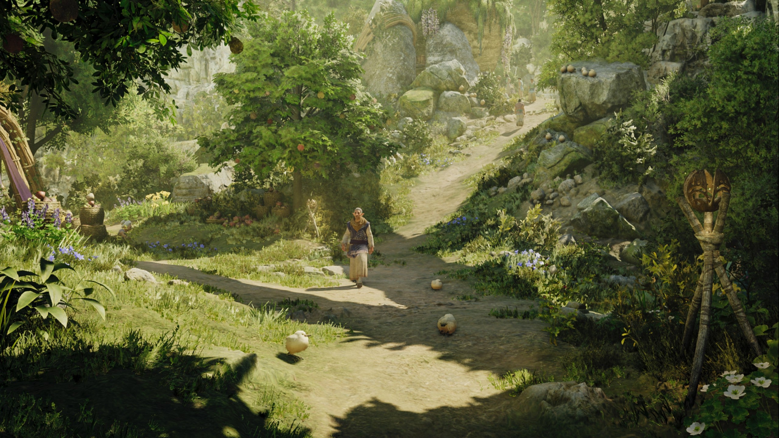 A Monster Hunter Wilds screenshot in the Suju village where someone is walking down a dirt path surrounded by greenery and baby Seikrets.