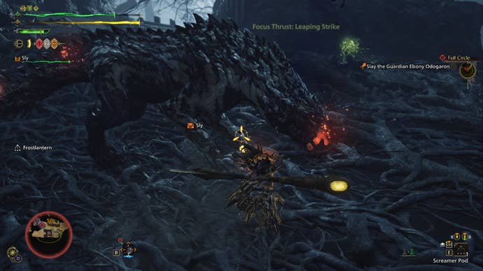 A Monster Hunter Wilds screenshot showing red glowing wounds on the Guardian Ebony Odogaron as the hunter attacks them.