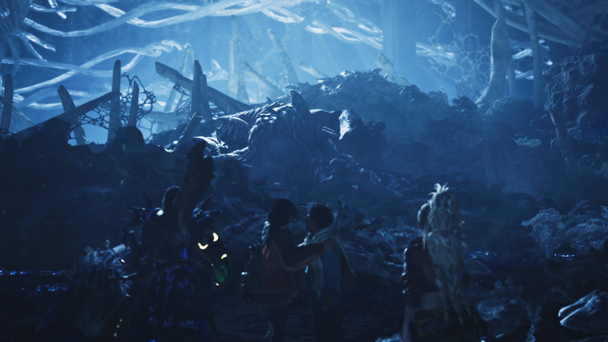 A Monster Hunter Wilds screenshot showing the hunter and their three companions watching Arkveld back as they eat. - 4