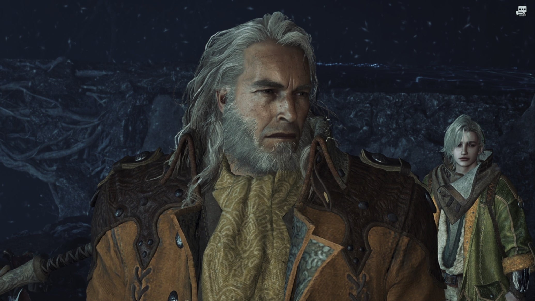 A Monster Hunter Wilds snowing screenshot close-up of Fabius with Erik in the background. - 1