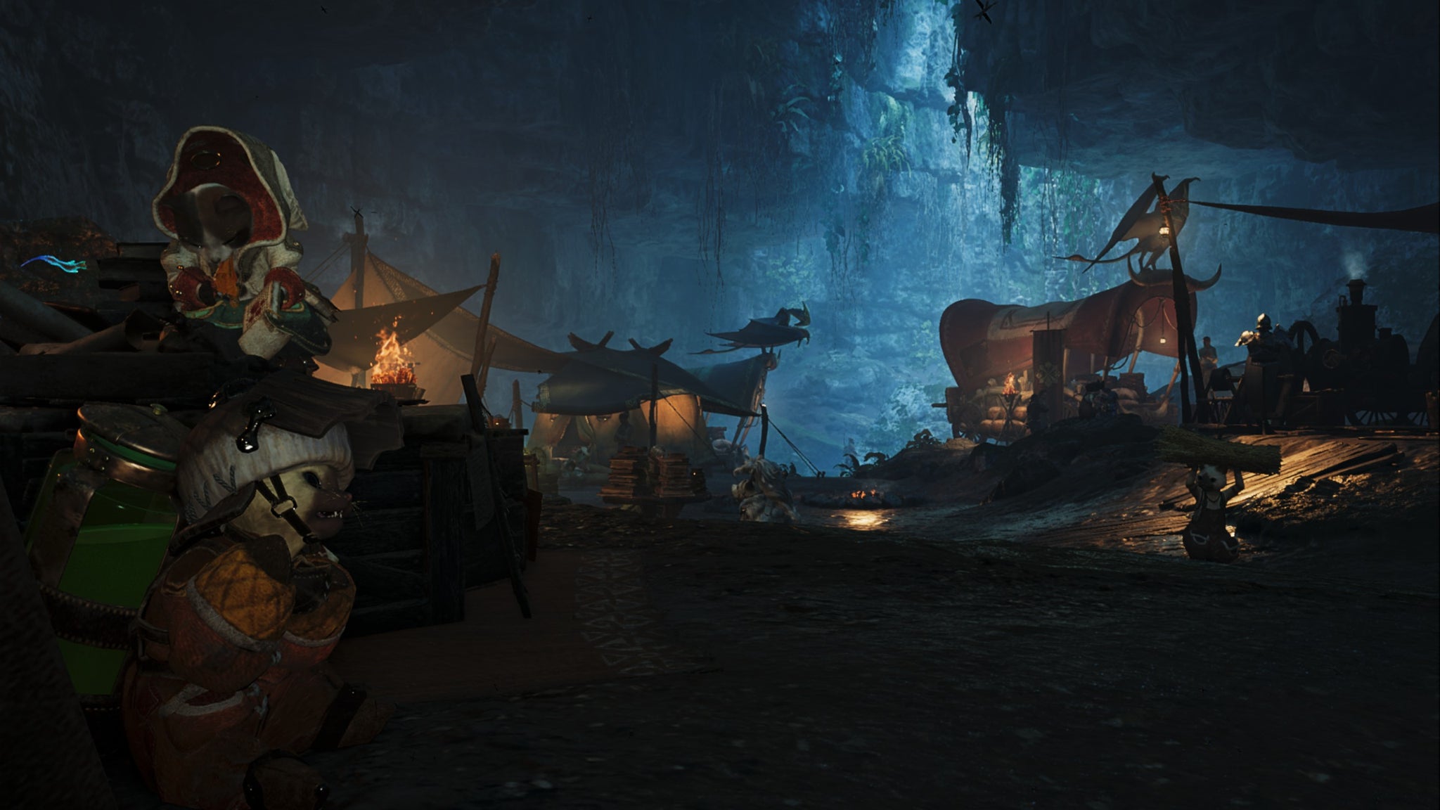 A Monster Hunter Wilds screenshot of the Scarlet Forest Base Camp inside a cave with light peeking through from above. - 6