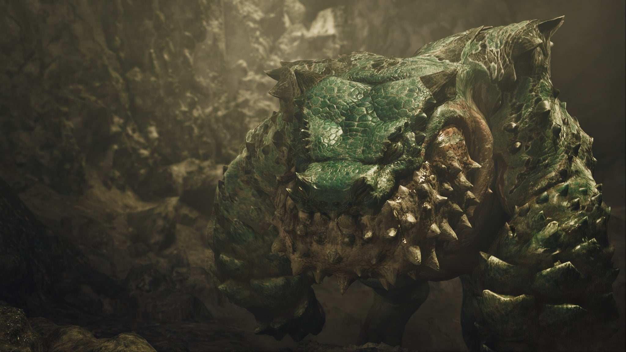 A Monster Hunter Wilds cutscene showing the green Chatacabra up close with a rock wall behind them. - 4