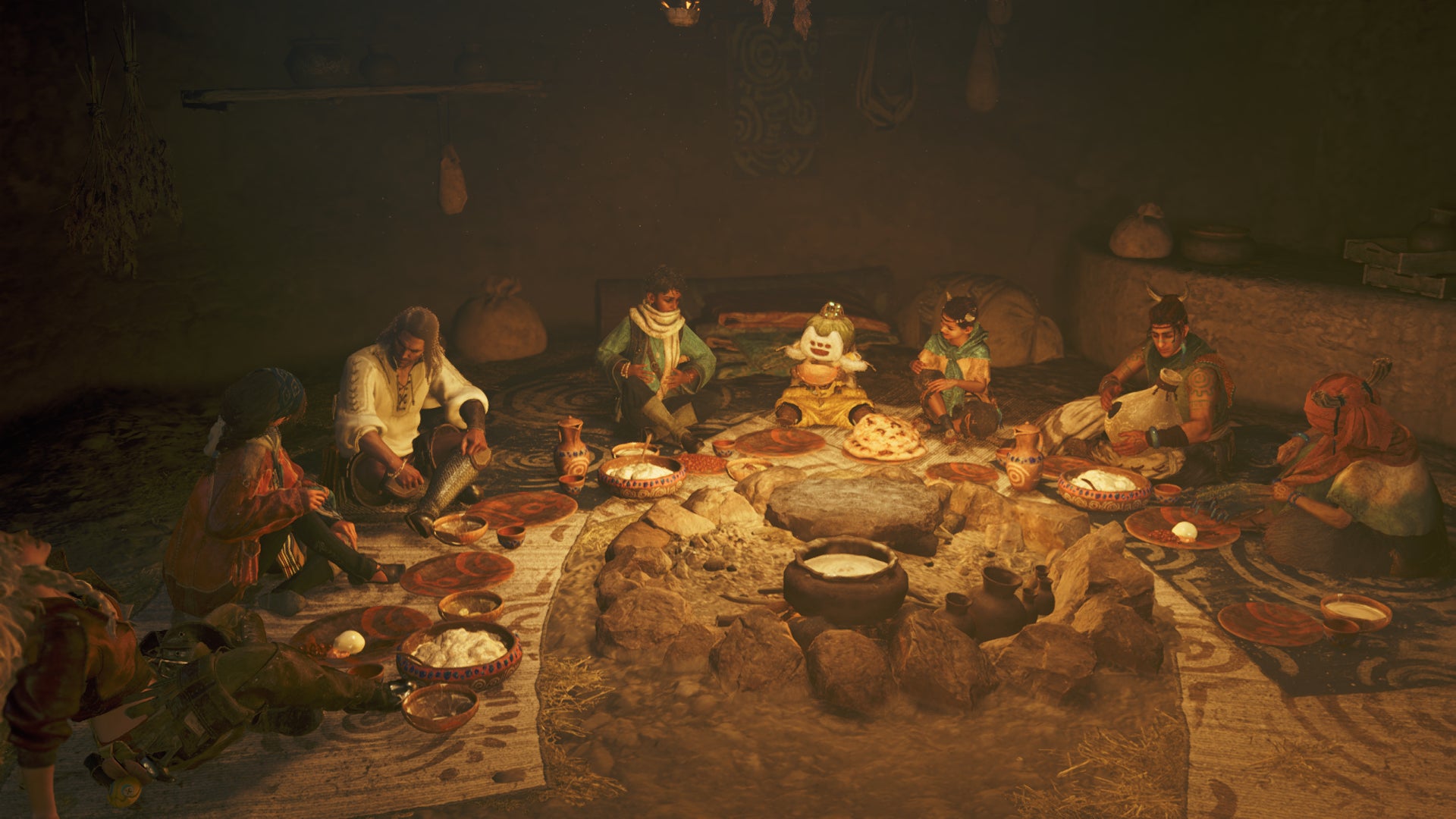 A cheerful group dinner around the fire in a Monster Hunter Wilds cutscene. - 3