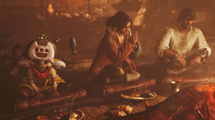 Monster Hunter Wilds screenshot showing a trio enjoying a feast together
