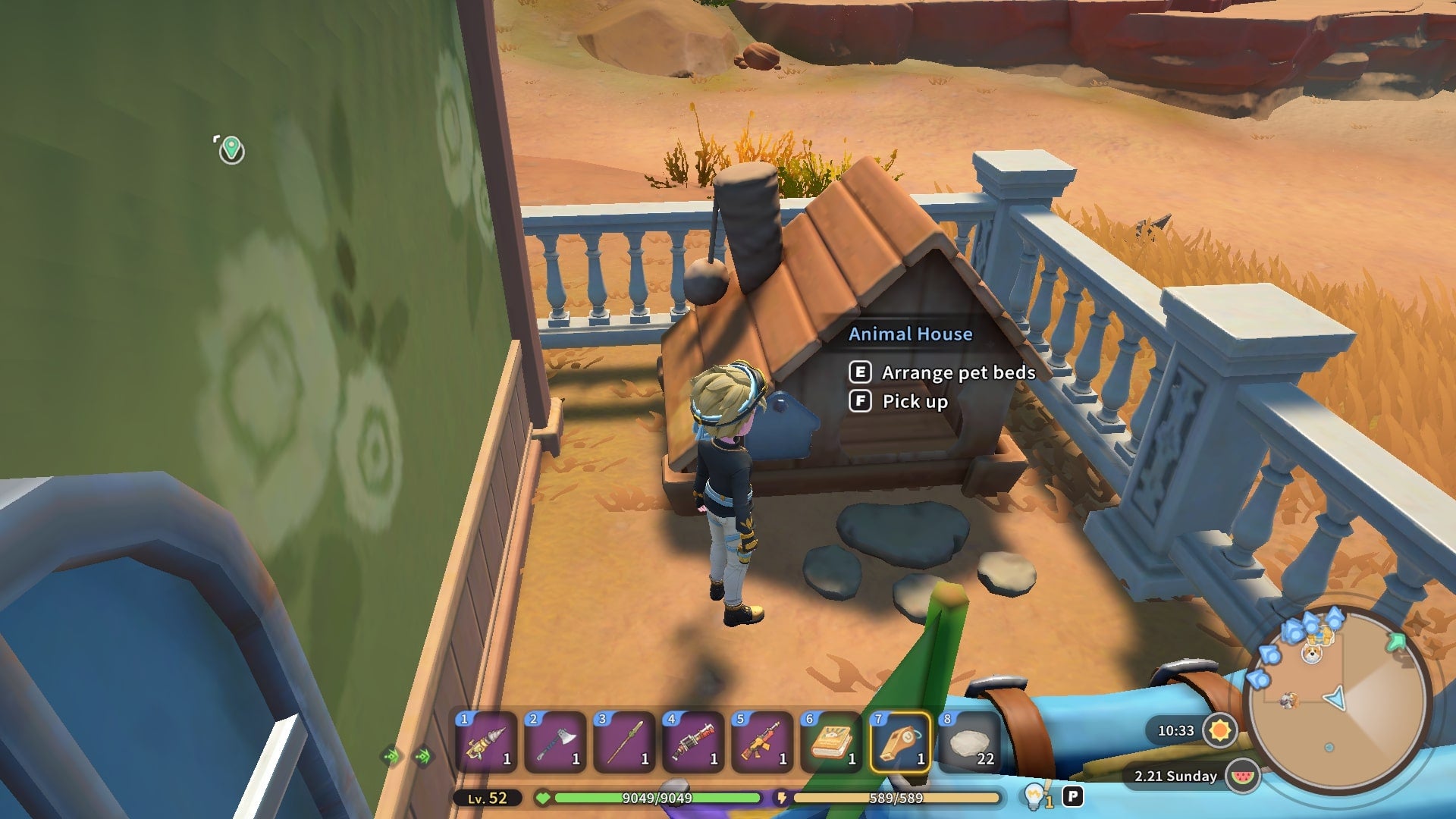 The player stands in front of their Animal House in their workshop in My Time at Sandrock