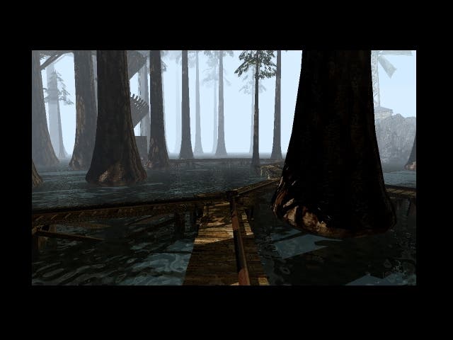 Misty woods with thin light spreading between the trunks of dark trees in this screen from Myst