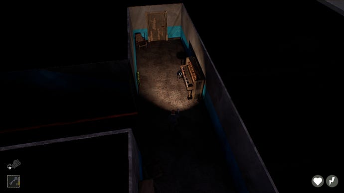 The interior of a building at night, lit by the player's torch, from above