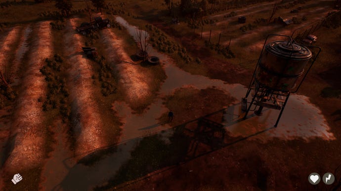 从上往下看，一片被夕阳染成橙色的田野，右侧有一个高架筒仓
