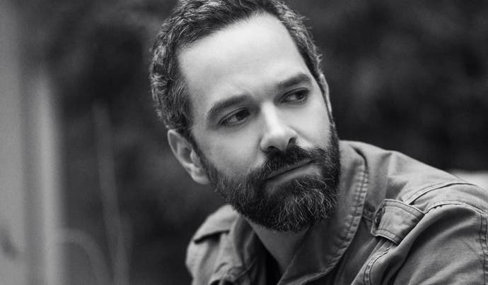 A black and white image of Neil Druckmann