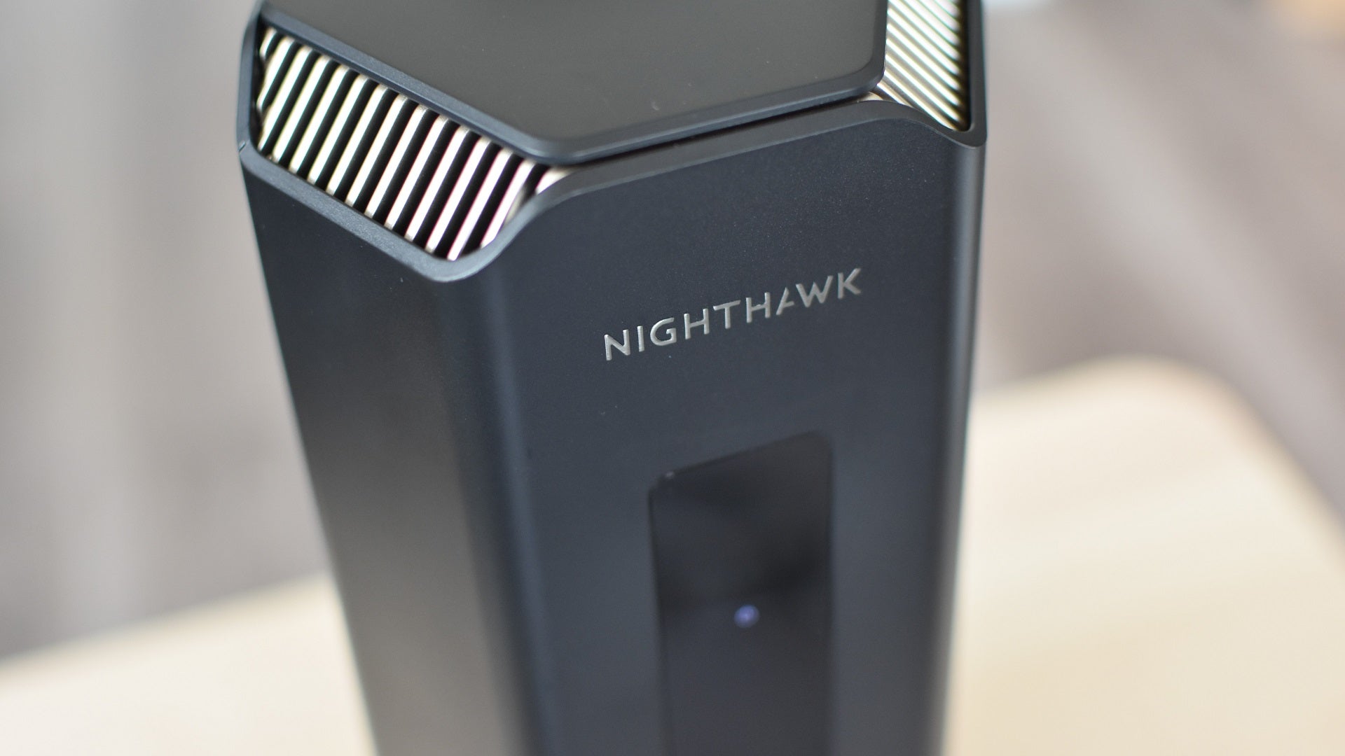 A closeup of the Nighthawk logo on the Netgear Nighthawk RS700 Wi-Fi 7 router. - 7