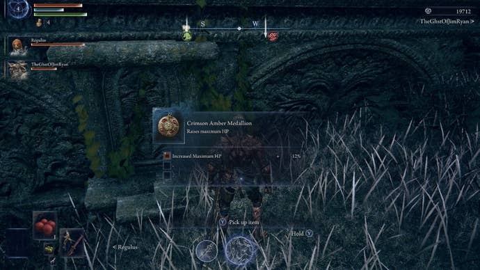 The player - an Executor - looks at a Talisman on the ground that has been dropped by a Teardrop Scarab in Elden Ring: Nightreign