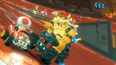 Mario Kart World trailer screenshot showing Bowser sliding on a kart next to Toad