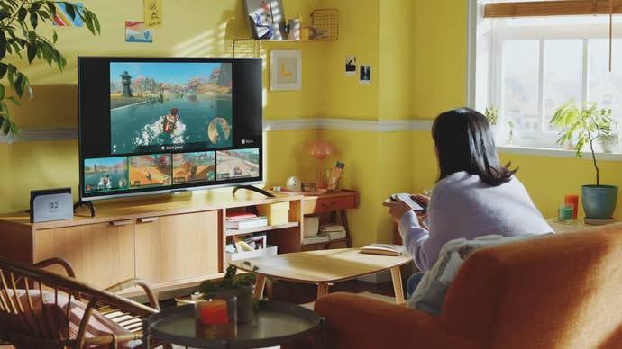 Nintendo Switch 2 screenshot showing a woman playing alone in her lounge with four others on the TV screen
