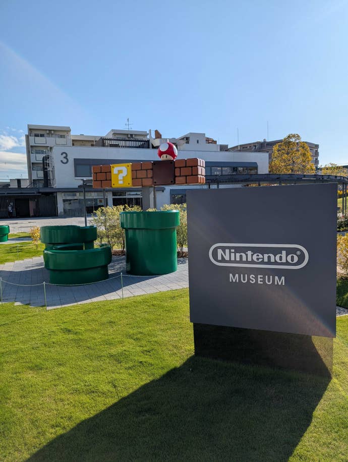 A Nintendo sign and life-size green ‘Mario pipes’ in the Nintendo Museum.
