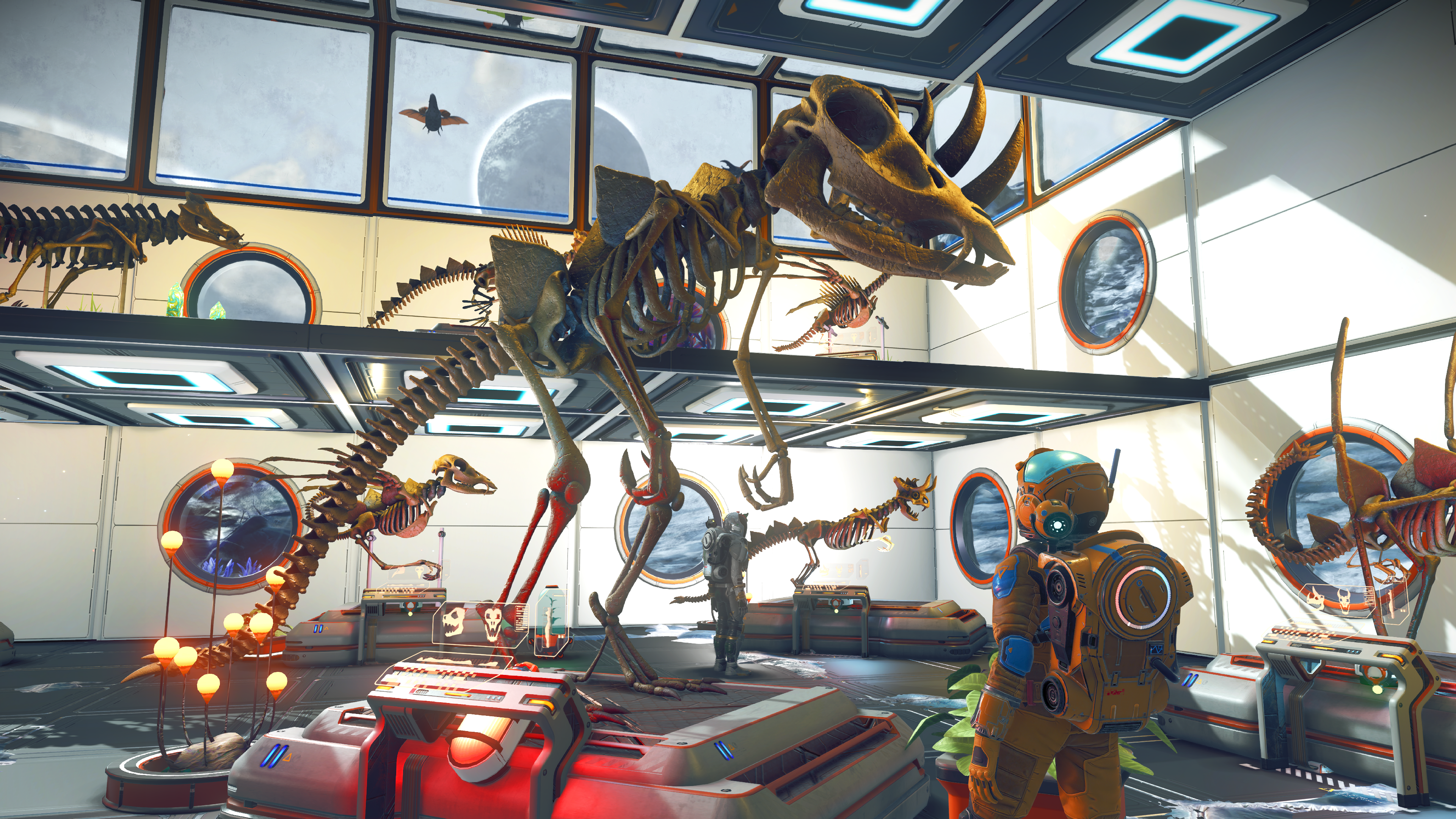 No Man&rsquo;s Sky screenshot showing a player admiring a large creature skeleton assembled from prehistoric bones on display in their base.