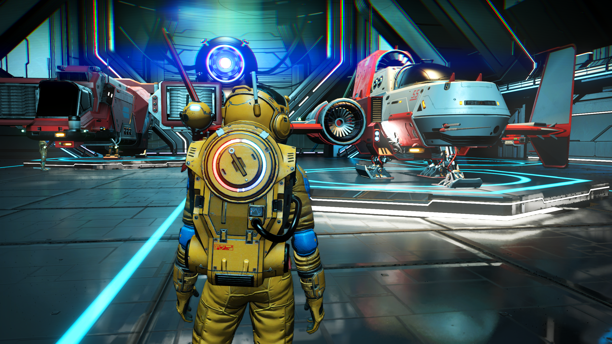 TAA used in No Man&rsquo;s Sky. A spaceman stands in front of some spaceships within a hangar.
