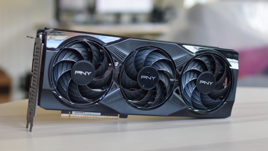 The PNY GeForce RTX 5070 OC connected  a table, with its triple fans facing the camera.
