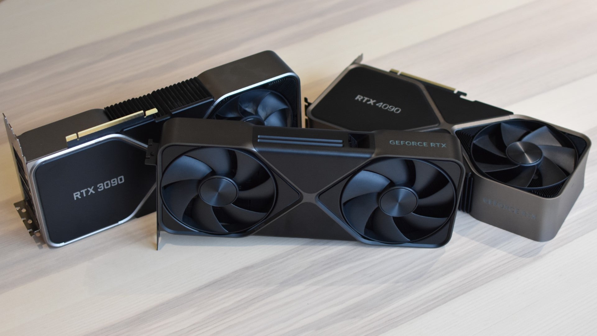The Nvidia GeForce RTX 5090 Founders Edition next to Founders Editions of the RTX 4090 and RTX 3090. - 3