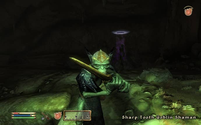 A goblin shaman has its sword up, ready to attack the player character in Oblivion.