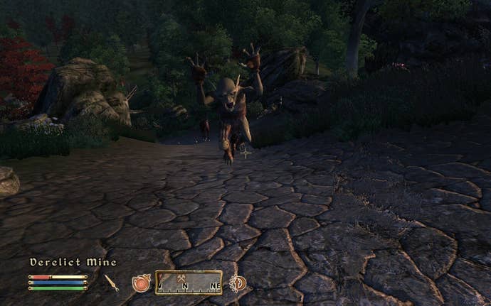 A Goklin joins the role of the player, his arms are in the air.
