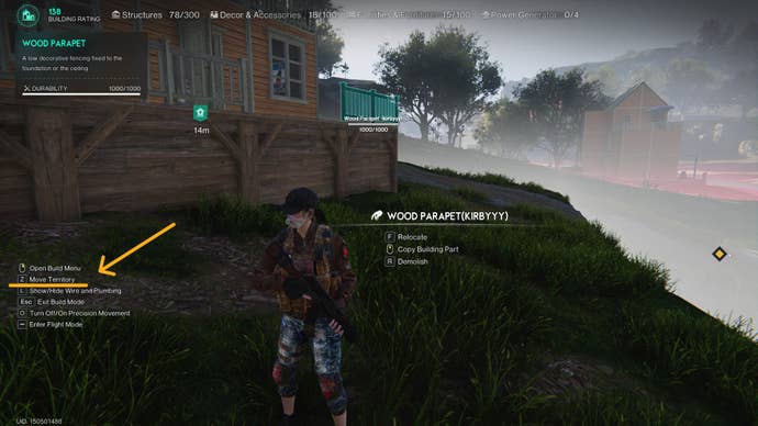 The player stands outside of their territory with the build menu open in Once Human: the option to move territory is labelled