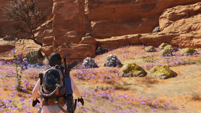 The player looks over at multiple ore deposits in the Red Sands region of Once Human