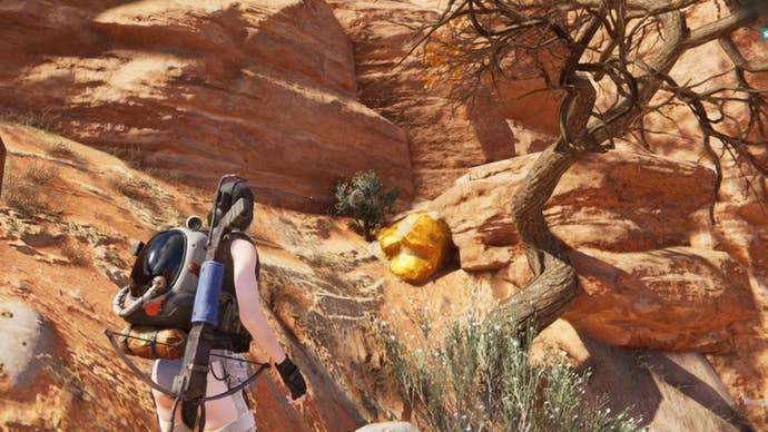 The player looks at a Gold Ore deposit in a wall in Once Human’s Red Sands region