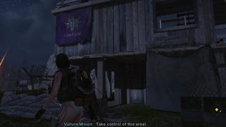 The player looks at a wooden building with a cultist flag at the Believer's Colony in Once Human