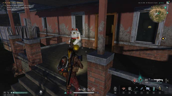 The player looks at a Lucky Cat on the patio of a house in Once Human