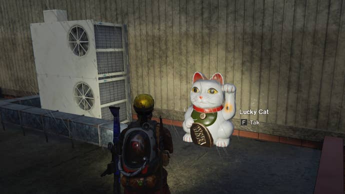The player looks at a Lucky Cat on a rooftop in Once Human
