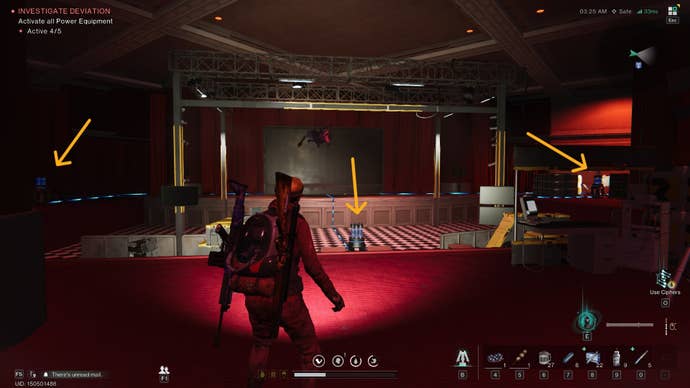 The player stands in a theater in the Securement Silo Alpha in Once Human, three pieces of power equipment are labeled