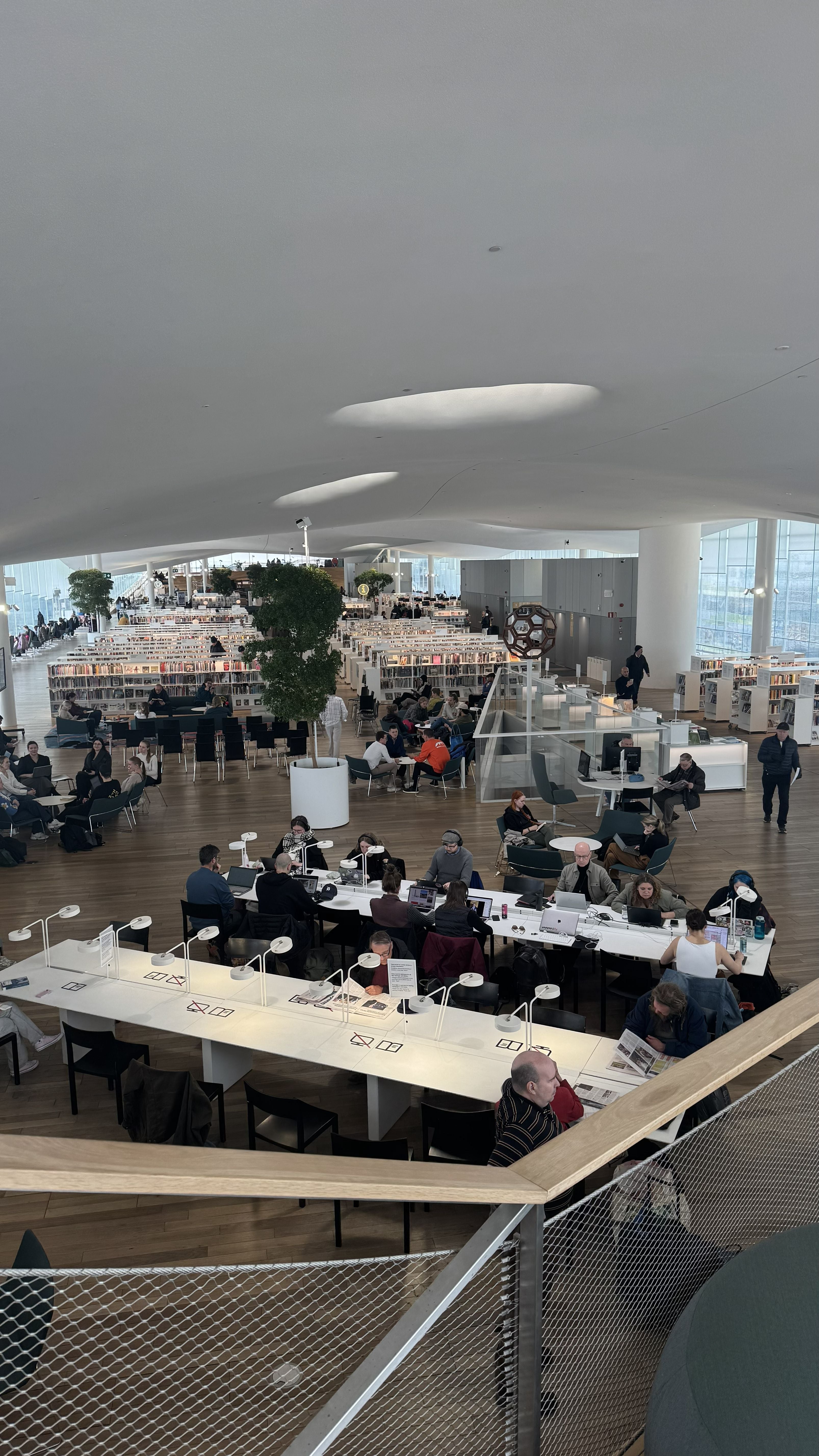 Photo of the Oodi Library in Helsinki showing the busy top floor of the building